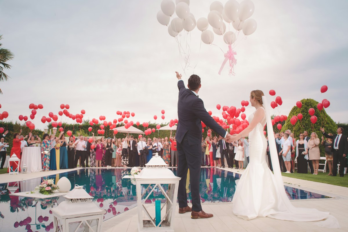 Luxury rose arch and candlelit aisle staging before sunset in Addis Ababa